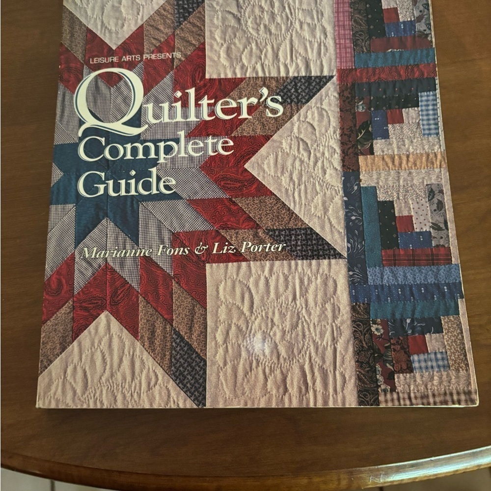 Red and Blue Log Cabin Quilt with Intricate Stitching